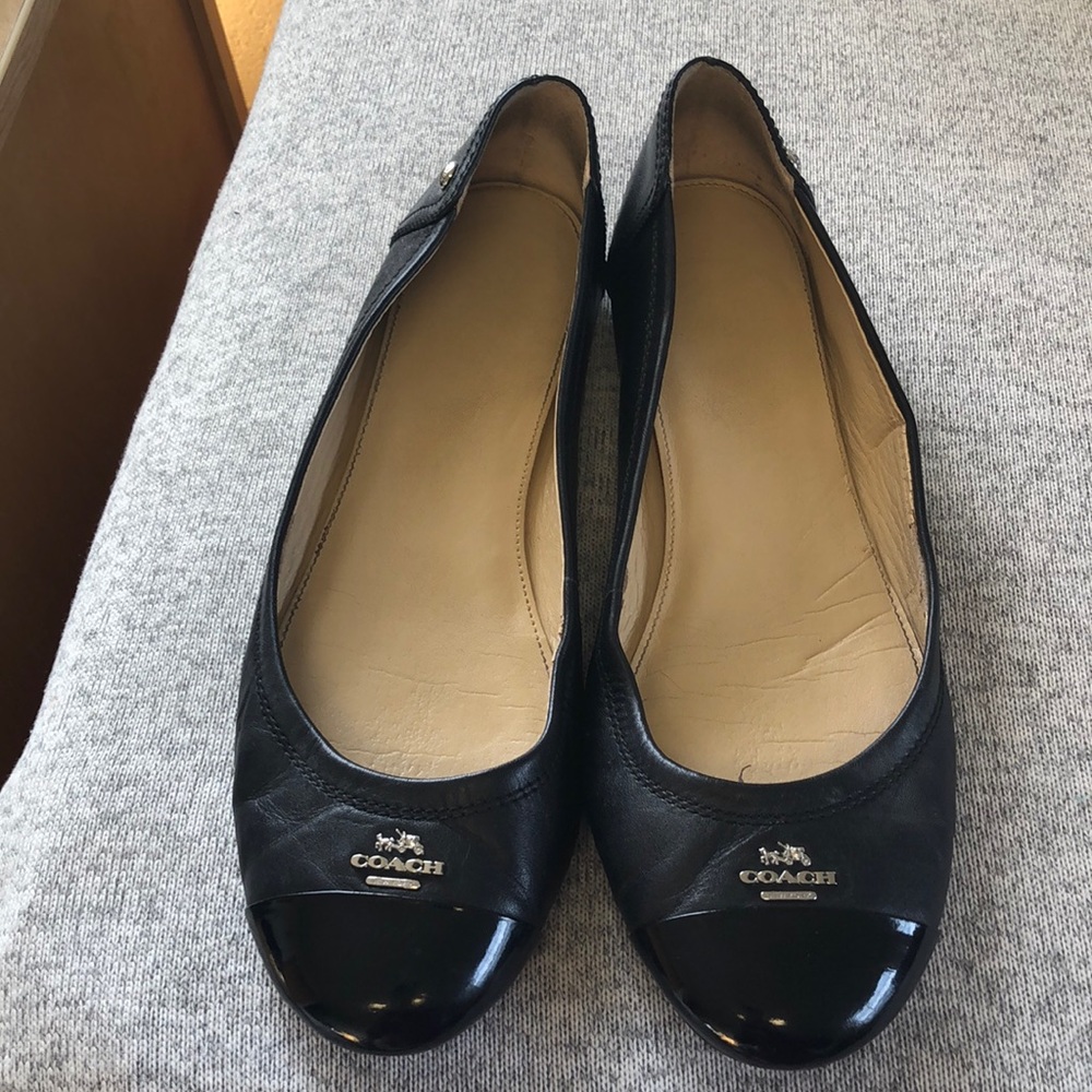 Coach flats.